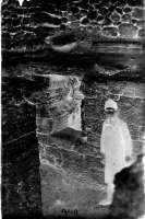 A boy in the excavated room of the so-called mint. 1904