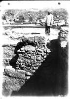 A worker on the excavations of an ancient construction in the Main Street