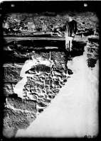 A worker on the excavations of an ancient construction in the Main Street