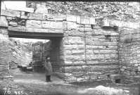 Unknown person standing in the ancient gateway