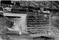 Unknown person standing in the ancient gateway