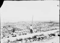 M. I. Skubetov (?) sitting in the area of the Main Street