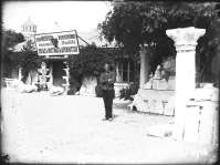 Unknown person standing in front of the entrance to the Imperial Archaeological Commission’s museum