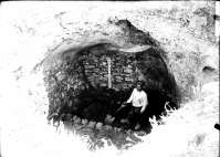 A worker on the excavations of a water cistern in the central area of the ancient city (in the main street?)