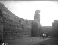 Military men (officer and soldier?) in between of the defensive walls
